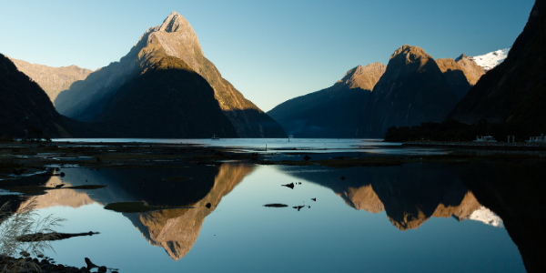 scenery of mountains with their perfect reflection in a lake. Cool scene with blue colours