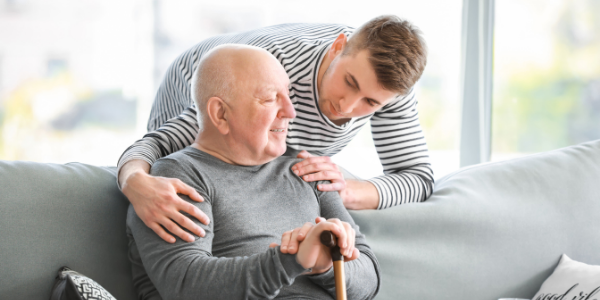 Young man caring for father