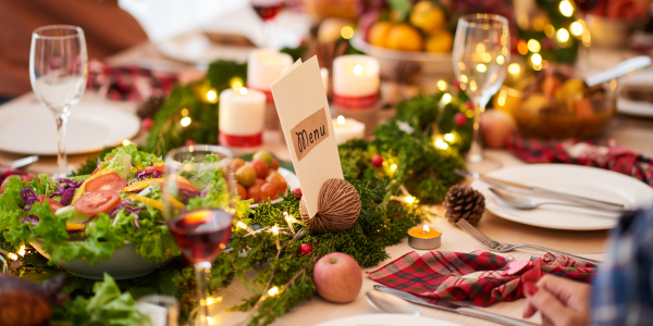 christmas dinner table laid out with natural decorations
