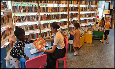 Image of children choosing books at the Chestnut Centre library