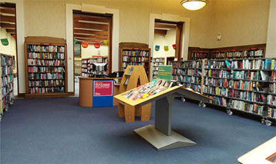 Image of bookshelves and displays inside Cleckheaton Library