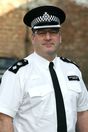 Police Chief Superintendent Jason Gwilliam with hat