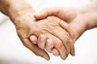 Care Act carer holding hands with elderly person
