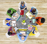 Library overhead shot of table with books computers