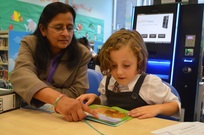 Library Volunteers Bharti with a girl called Izelda