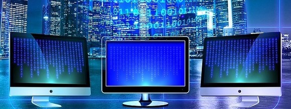 computer monitors showing binary