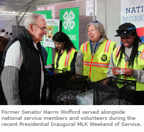 Senator Harris Wofford serves alongside national service members