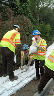 AmeriCorps Members with California Conservation Corps fill sandbags prior to a strom in Palo Alto, CA