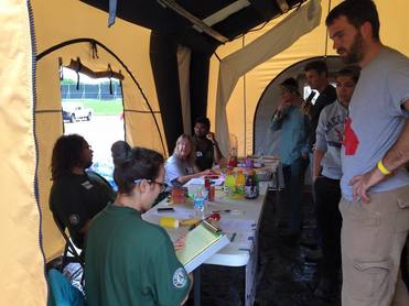 AmeriCorps Members registering the hundreds of volunteers that have come to help the community of Van, TX