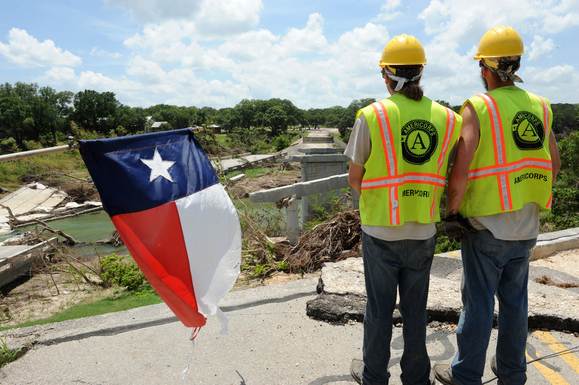 AmeriCorps Members Looking Out Over Flood Damage in Texas