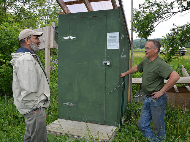 USDA Natural Resources Conservation Service Soil Conservationist Danny Peet, works with Vermont farmer Lorenzo Whitcomb to implement edge-of-field wat