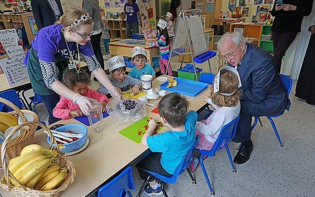 USDA Undersecretary of Food, Nutrition, and Consumer Services Kevin Concannon participates in a hands-on lesson about local foods at a YMCA preschool 