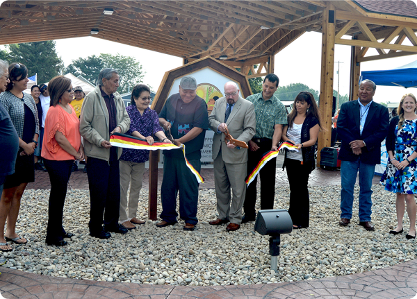  U.S. Dept. of Agriculture Rural Development State Director for Michigan James J. Turner (fifth from right) cutting the ribbon for the Mt. Pleasant Na