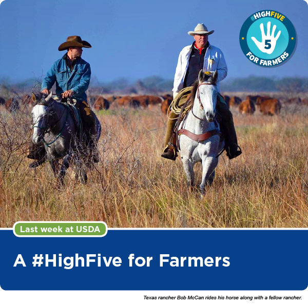 Texas rancher Bob McCan rides his horse along with a fellow rancher.