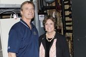 Colleen Landkamer and John Miller in the room where Freeborn Lumber controls its geothermal system.