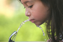 Photo of girl drinking from fountain