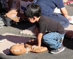 Boy doing CPR drill