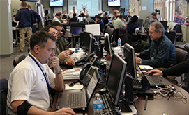 Photo of people at computer supporting the Superbowl