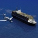 plane and cargo ship
