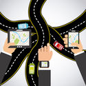 A graphic of business people holding various devices with GPS over a background of intersecting roads.