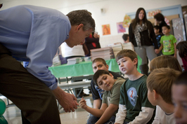 Arne Duncan with school children affected by Sandy