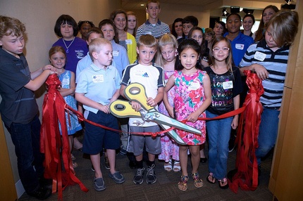 Artful Expressions artists from North Carolina cut the ribbon on the display of their work at ED.