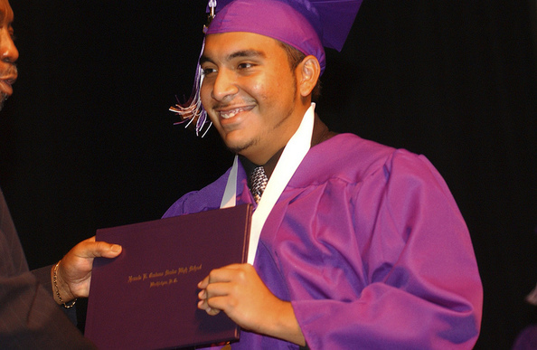 Young Hispanic Male Graduating 