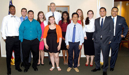 Secretary Duncan takes a photo following his meeting with a group of young people.