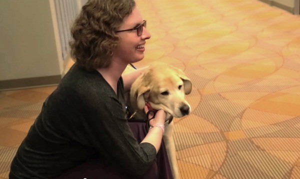 still from video of Kathy Nimmer with her dog