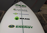 Photo of algae surfboard with Department of Energy logo