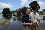 FEMA Workers Look at list after flood