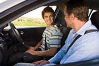 Dad and teen son in the car