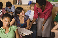 Teacher helping a student in class