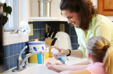 Mom and daughter washing hands