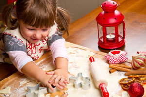 Little girl baking holiday cookies