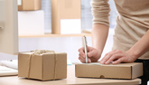 Woman preparing postal boxes