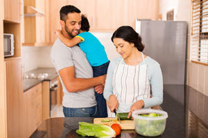 Couple with son in kitchen