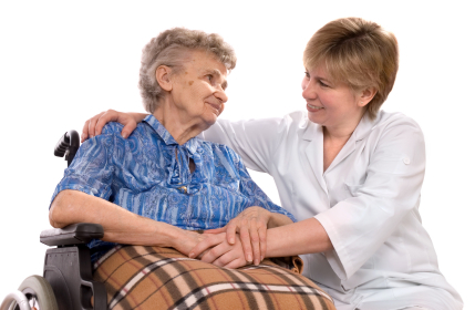 A senior sits with a nurse