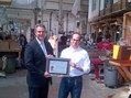 Under Secretary Francisco Sánchez presents Nikolas Weinstein of Nikolas Weinstein Studios an Export Achievement Certificate at his studio in San Franc