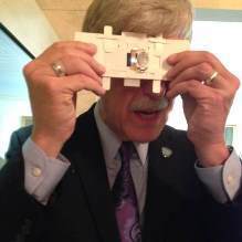 NIH Director Dr. Francis Collins using the Foldscope microscope.