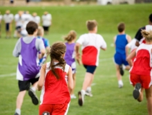 Children running on a field.