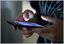 A person using a mobile symptom checker program.