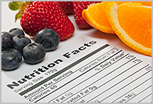 Fruit on top of a Nutrition Facts label.
