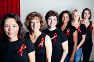 women with red ribbons