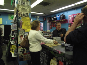 Administrator Mills purchases album at Vintage Vinyl