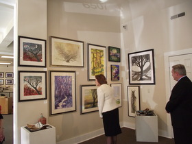 Mills and Melton admire artwork at Compônere