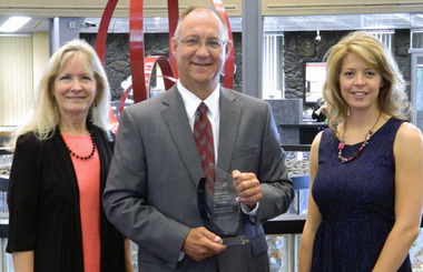 Kurt Haecker, flanked by Barb Foster and Sara McMillan