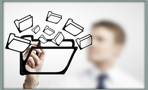 Image of a man behind a glass-like transparent writable board drawing folders and subfolders to represent electronic patient files and other electronic directories and information.