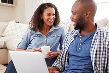 Young Couple Using a Laptop