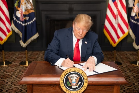 President Donald J. Trump signs an Executive Order in Bedminster, New Jersey, entitled "Reimposing Certain Sanctions with Respect to Iran." 